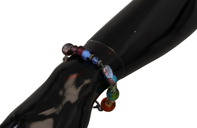 Multicolor beaded chain bracelet with brass and silver accents on black display