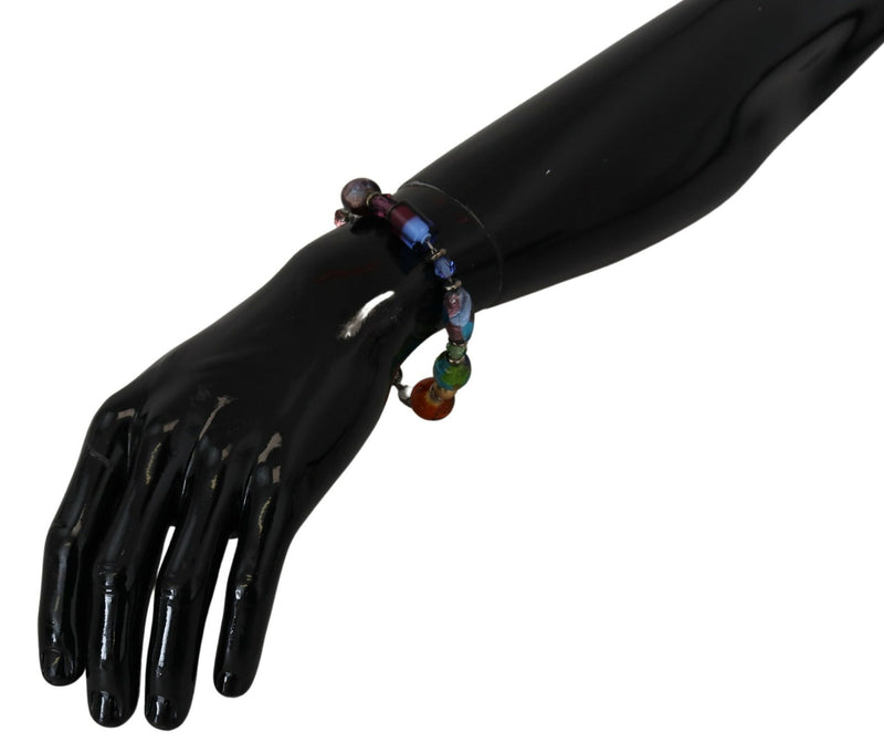 Multicolor beaded brass and silver chain bracelet worn on a black mannequin wrist