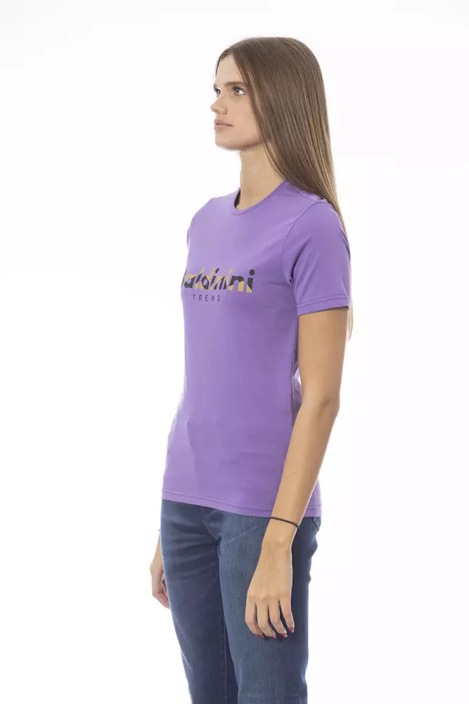 Woman wearing a purple cotton t-shirt with logo print and jeans