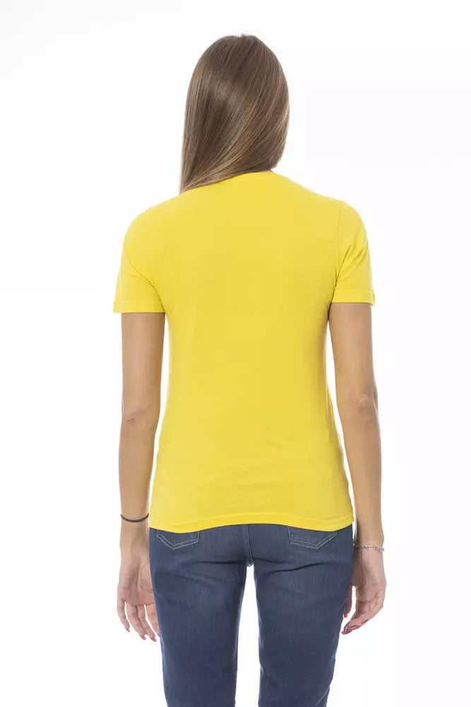 Back view of a yellow cotton women t-shirt paired with blue jeans