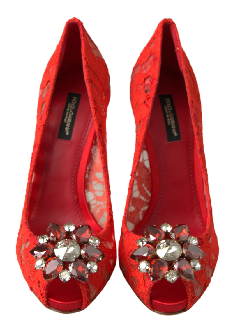 Dolce & Gabbana red lace peep-toe pumps featuring a large, ornate floral crystal embellishment at the toe.