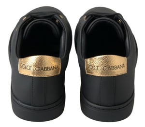 Black leather classic sneakers with metallic gold Dolce & Gabbana logo heel tabs.