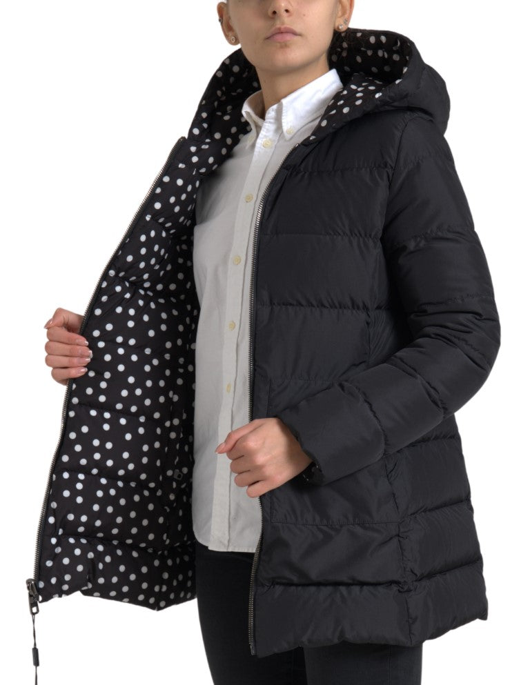 Black polyester reversible hooded jacket with a white polka dot lining