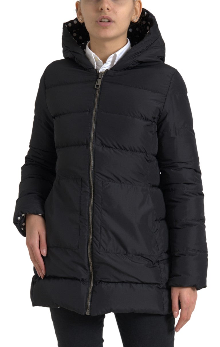 Black hooded puffer jacket with zip-up front and visible polka dot lining