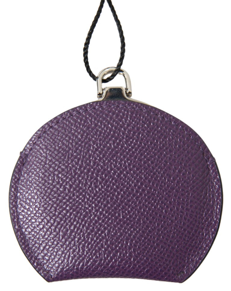 Round purple textured leather hand mirror holder with a black cord and silver hardware