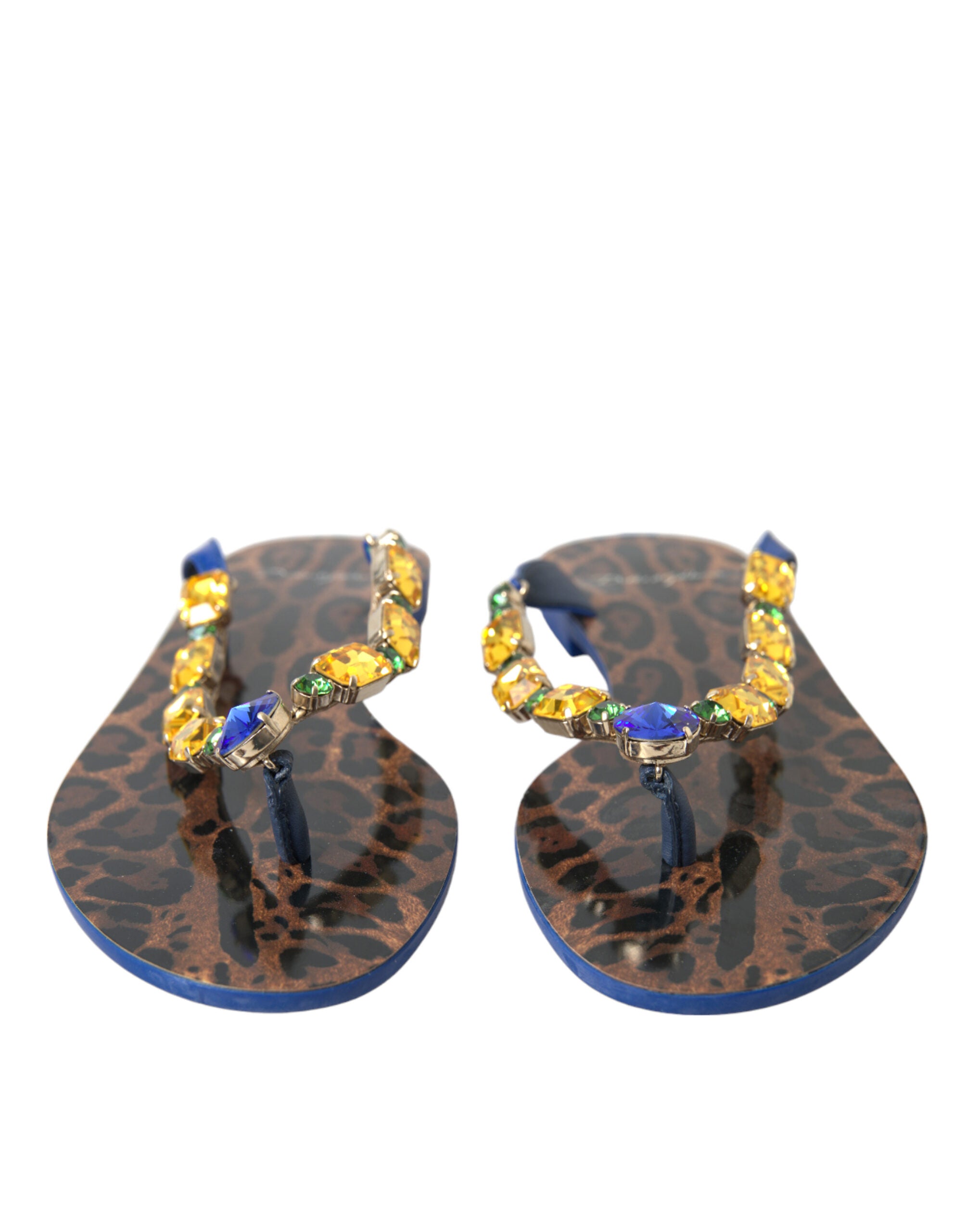 Dolce & Gabbana thong sandals in leopard print with embellished amber and blue crystal straps and blue soles.