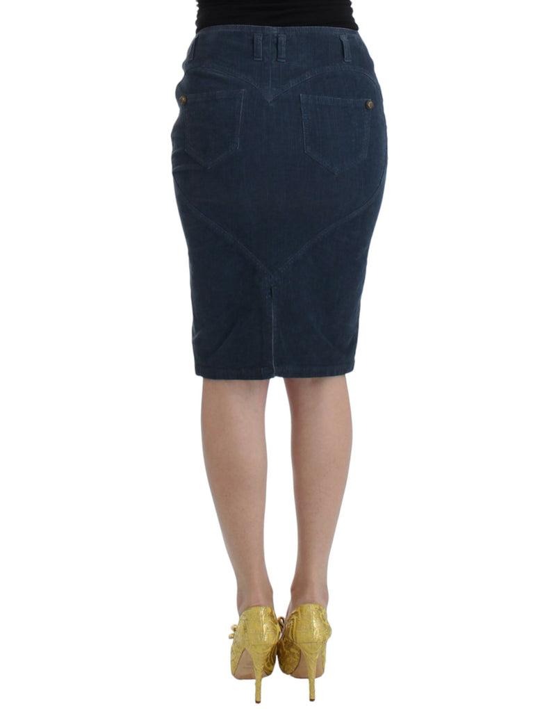 Blue corduroy pencil skirt with back pockets worn with gold heels