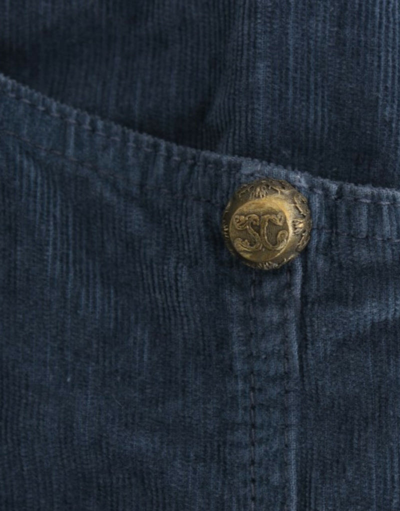 Blue corduroy pencil skirt featuring an ornate gold-tone button with engraved initials