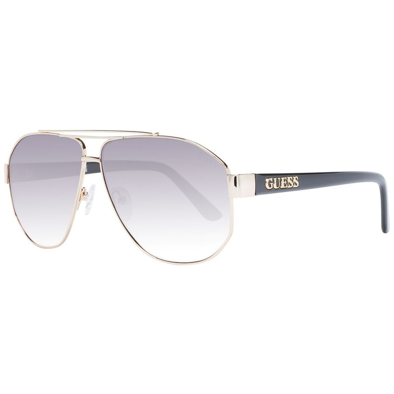 Gold metal aviator sunglasses with gradient lenses and black temples bearing the Guess logo