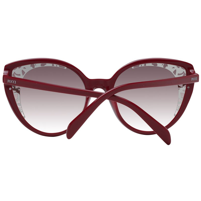 Red plastic cat-eye sunglasses with gradient lenses and folded temples