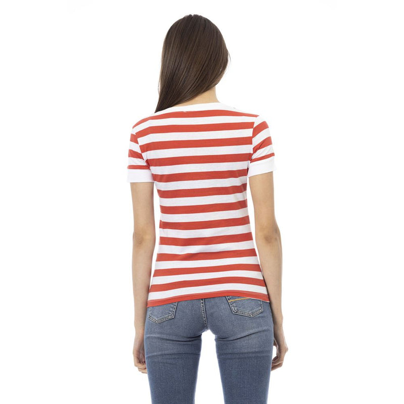 Woman wearing a red and white striped cotton t-shirt from behind