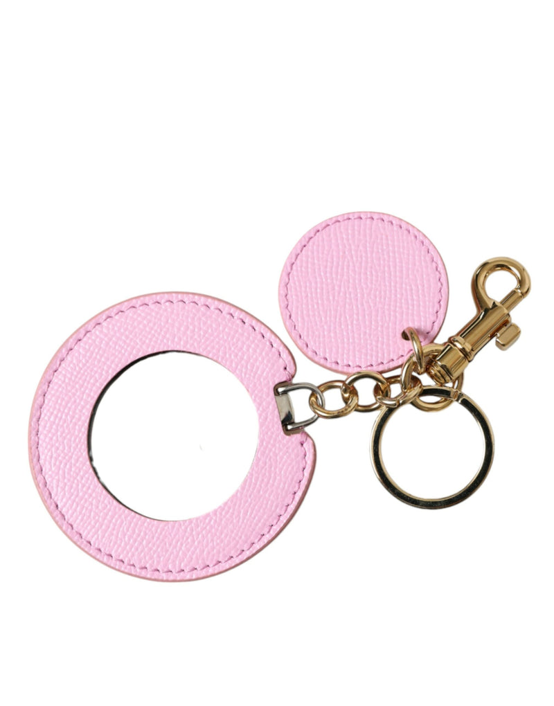 Pink calf leather and gold metal keychain with a large circular ring and small disc charm