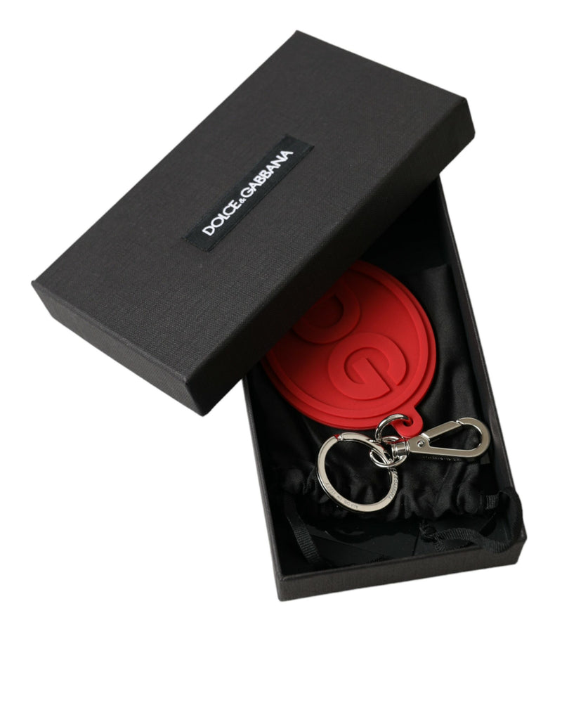 Red rubber DG logo keyring with silver brass hardware in an open black Dolce & Gabbana box