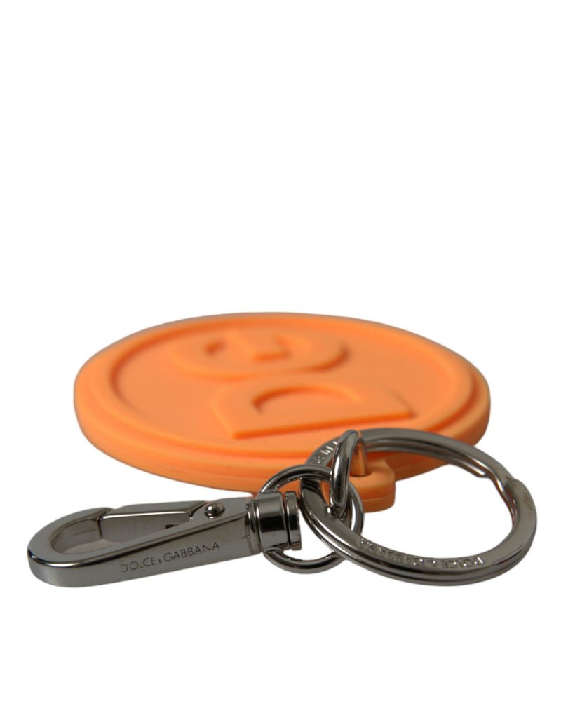 Orange rubber round keychain with raised DG logo and silver metal clasp and ring