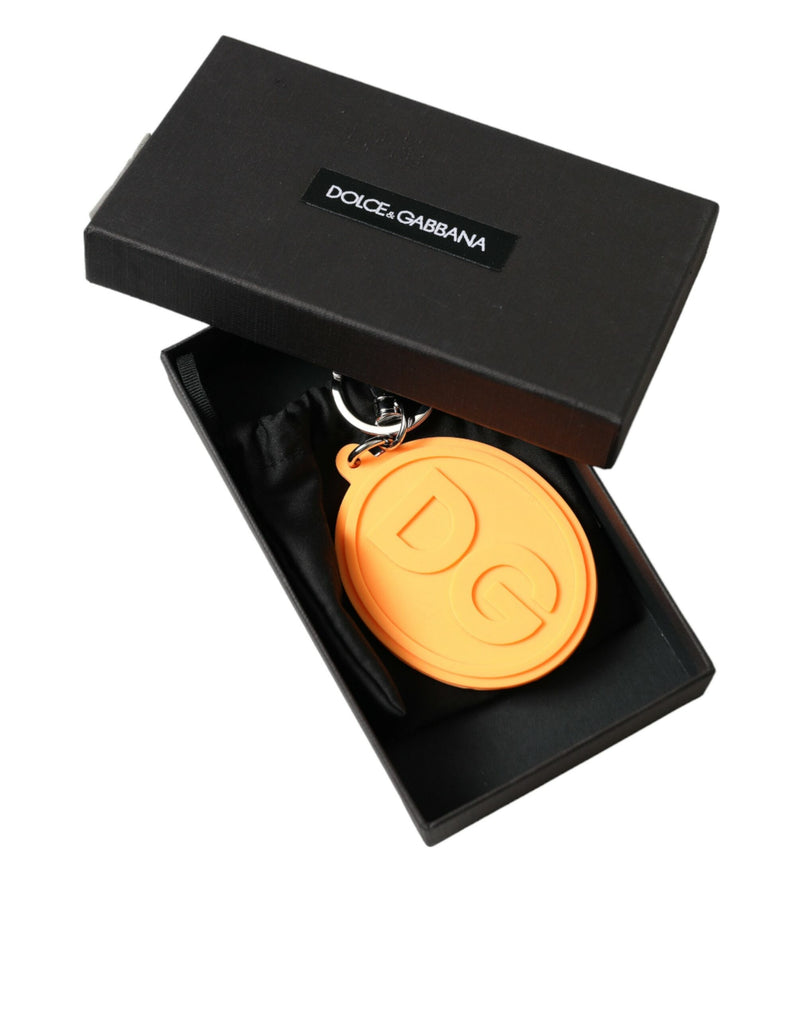 Orange rubber DG logo keyring with silver hardware inside an open black gift box