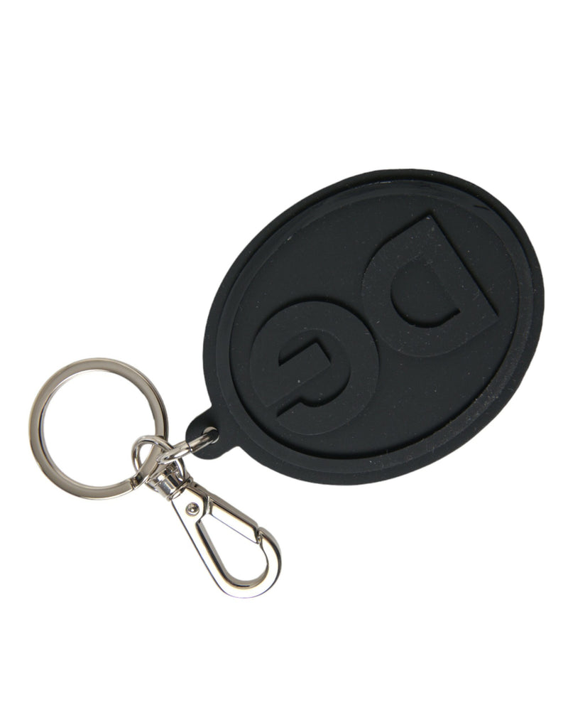 Black rubber oval keychain featuring a raised DG logo attached to a silver metal keyring and lobster clasp