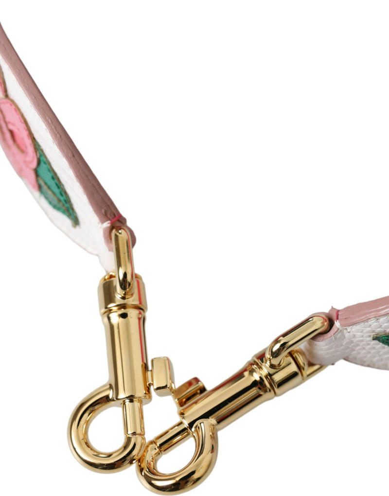 White leather shoulder strap featuring pink floral appliqués and gold tone hardware
