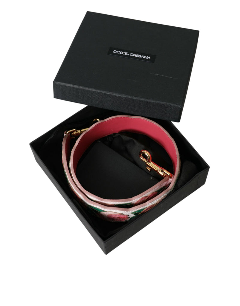 Coiled white leather shoulder strap with pink backing and floral embroidery inside a Dolce & Gabbana box