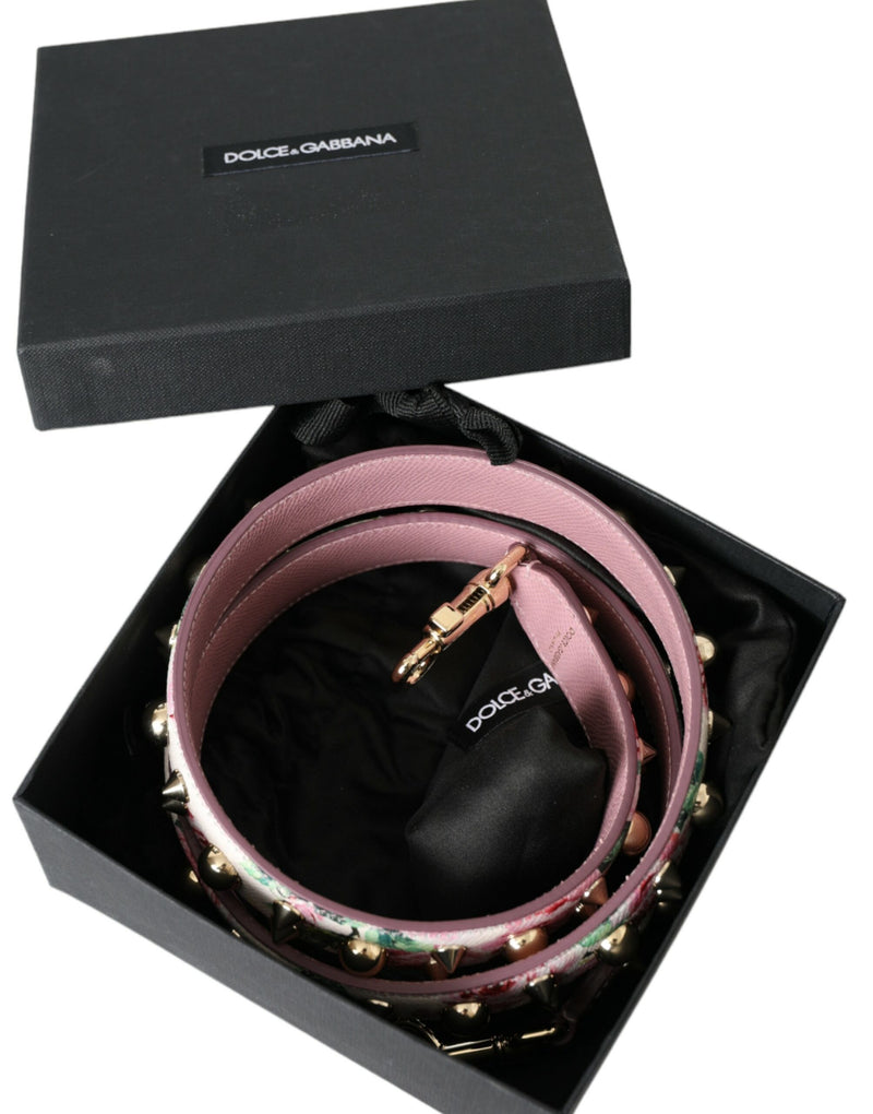 Pink floral leather shoulder strap with gold studs and clasps inside a black Dolce and Gabbana box