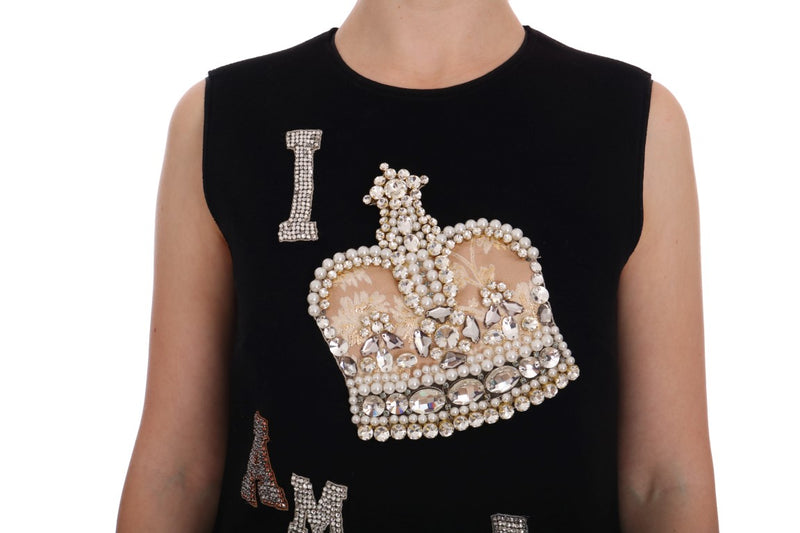 Black sleeveless wool shift dress with crystal and pearl embellished crown patch