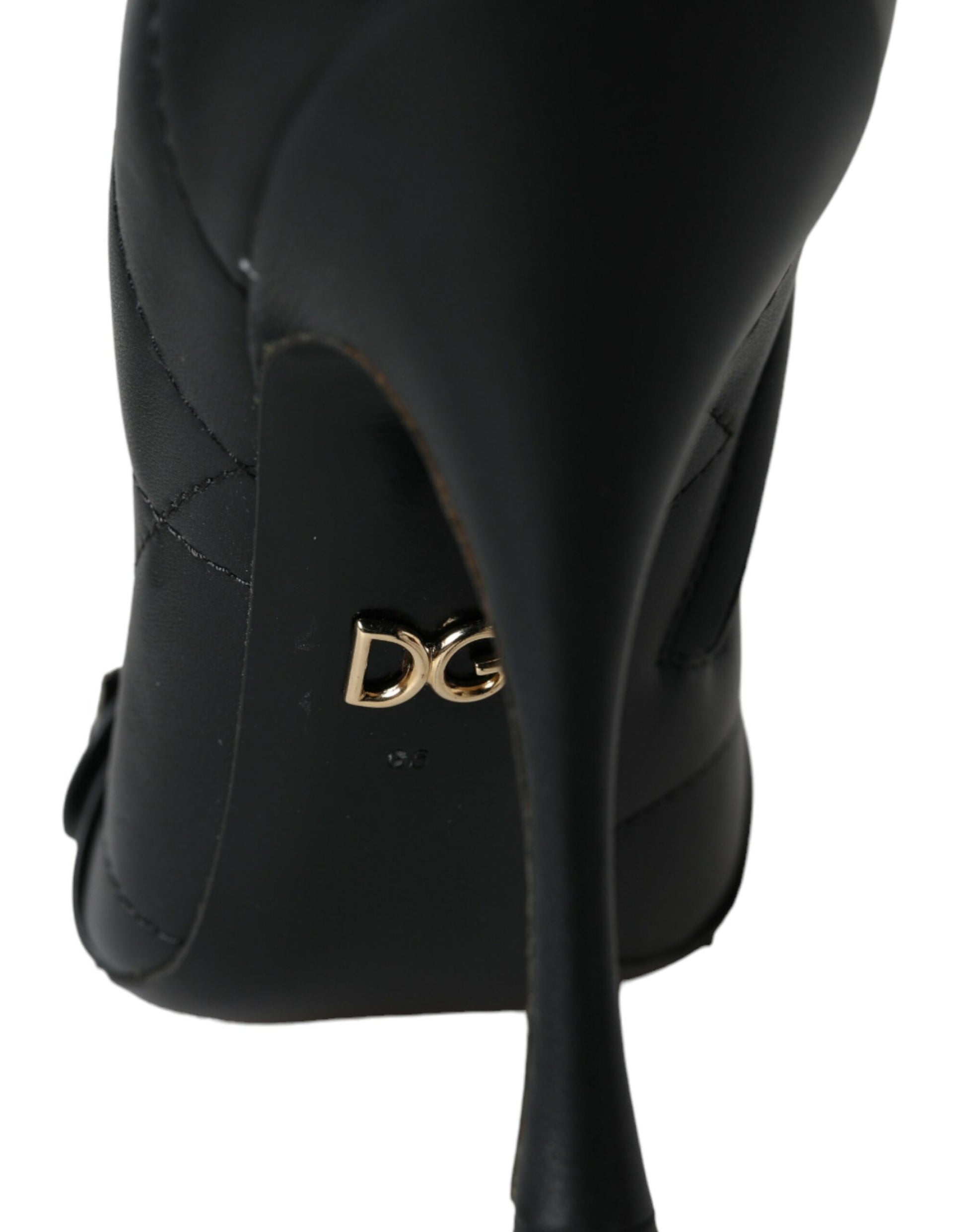 Black quilted leather stiletto boot with gold DG logo detailing on the sole.