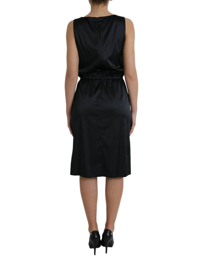 Black sleeveless polyester midi dress worn from behind