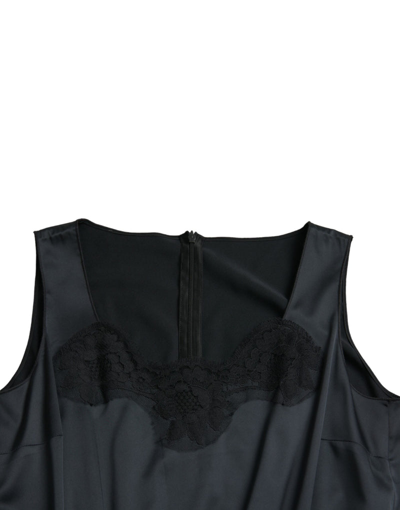 Black polyester midi dress with sleeveless scoop neckline and black lace trim on the bodice