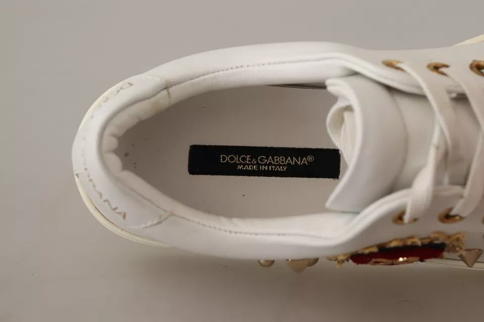 Top-down view of a white leather Dolce & Gabbana sneaker showing the interior logo label and gold eyelets.