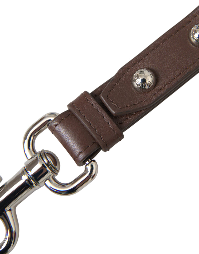 Brown leather keychain strap with silver-tone brass hardware and studs