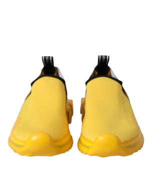Dolce & Gabbana yellow mesh slip-on sneakers with black trim and chunky yellow rubber soles.