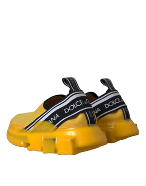 Bright yellow, stretch-knit Dolce & Gabbana Sorrento slip-on sneakers with chunky rubber soles and logo ribbon detail.