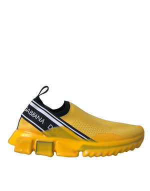 Dolce & Gabbana yellow knit slip-on sneakers with black branded logo strap and chunky translucent yellow rubber sole.