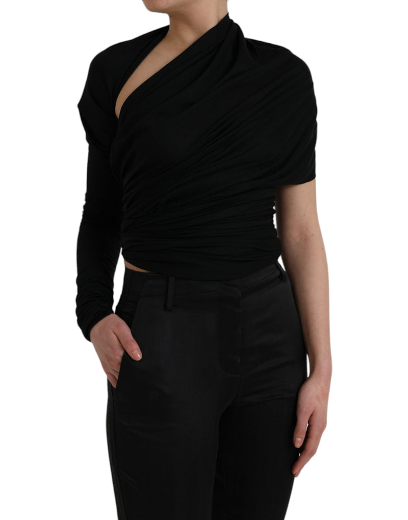 Black wool asymmetric long sleeve top with shoulder cutout and draped design