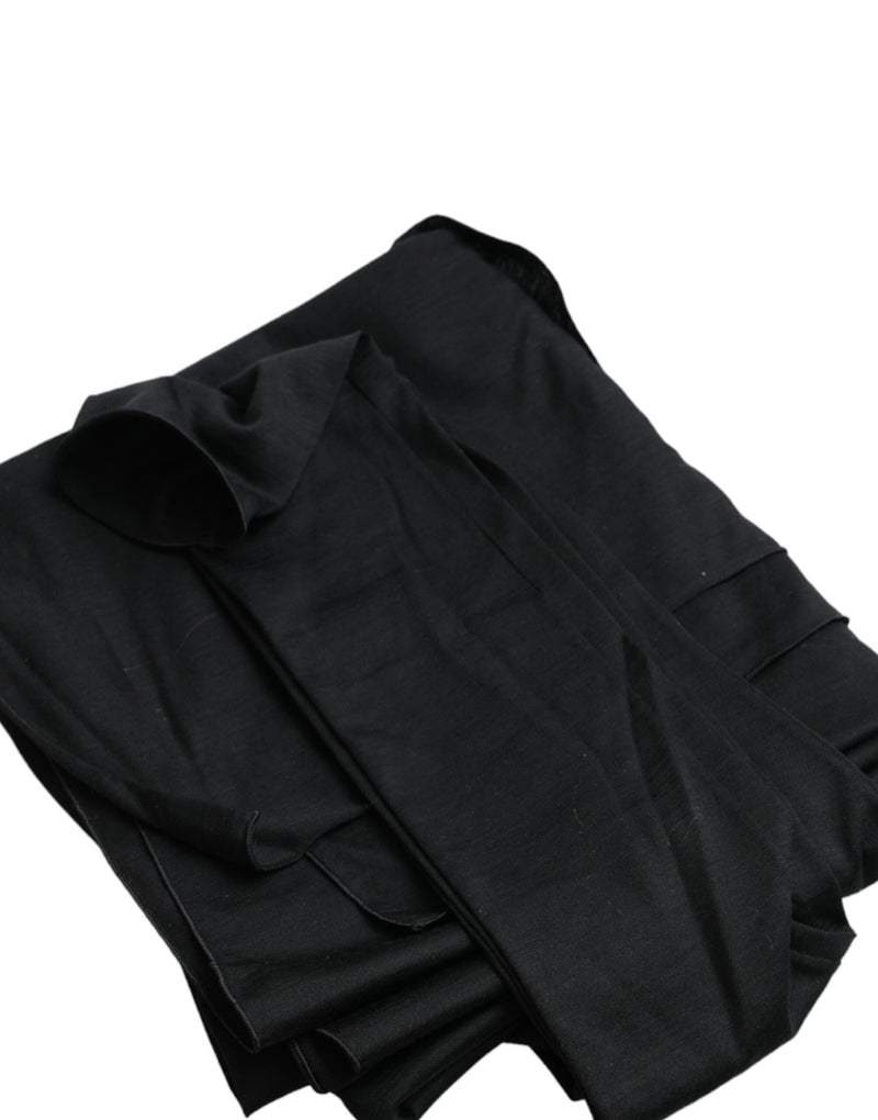 Folded black wool long sleeve top with an asymmetric cutout style