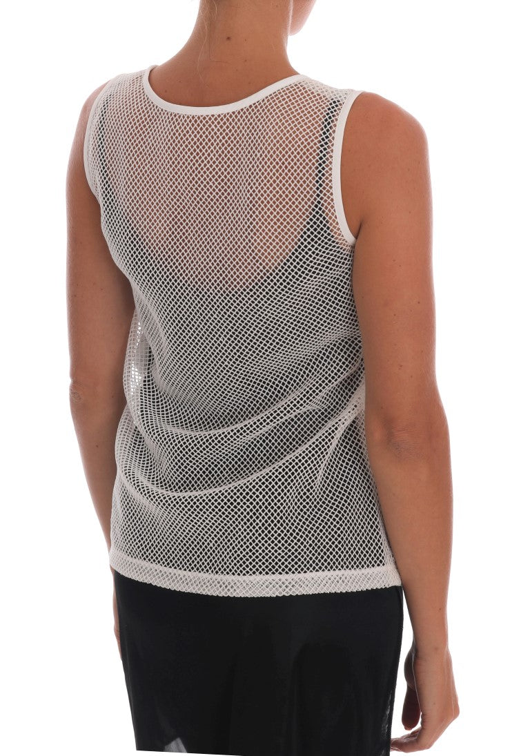 White net tank top with a transparent mesh design worn over black clothing