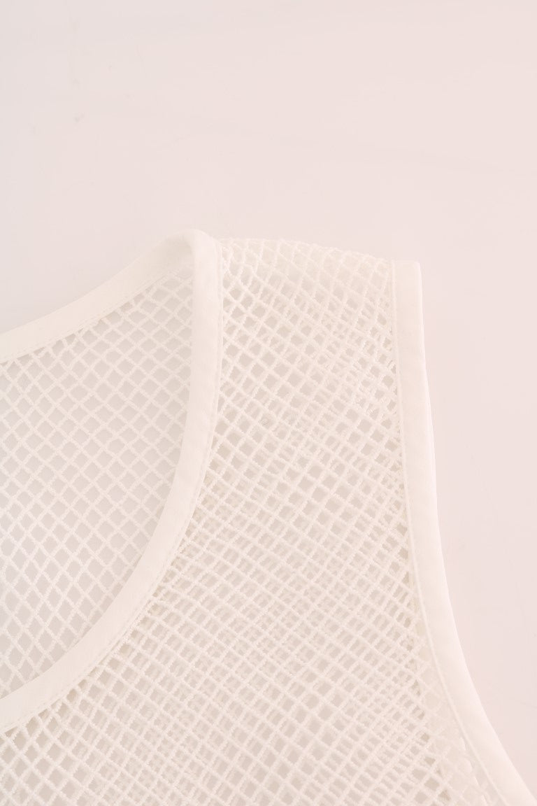Close-up of a white fishnet tank top with bound edges