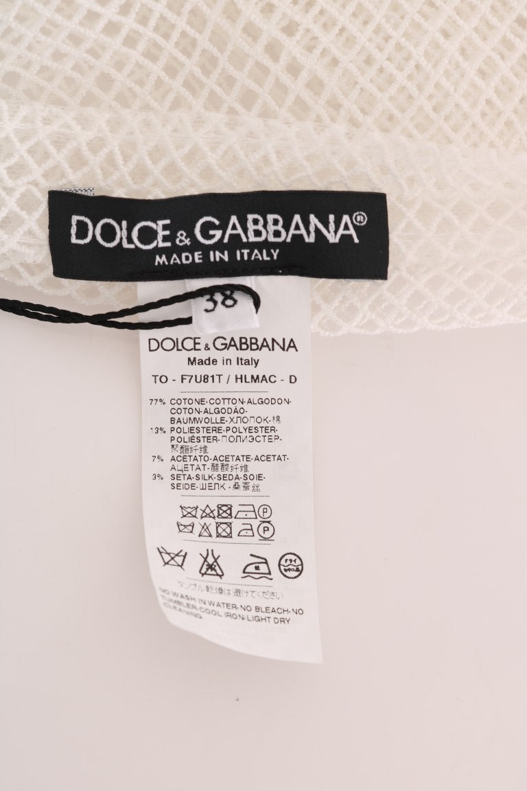 Dolce and Gabbana brand and material labels on a white net top