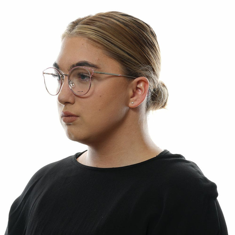 Pink metal and plastic eyeglasses frames worn on a person's face