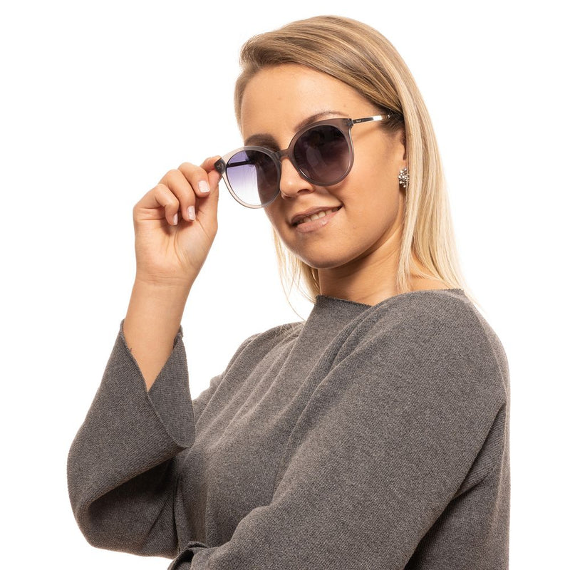 Bally gray plastic round sunglasses with gradient lenses worn by a woman
