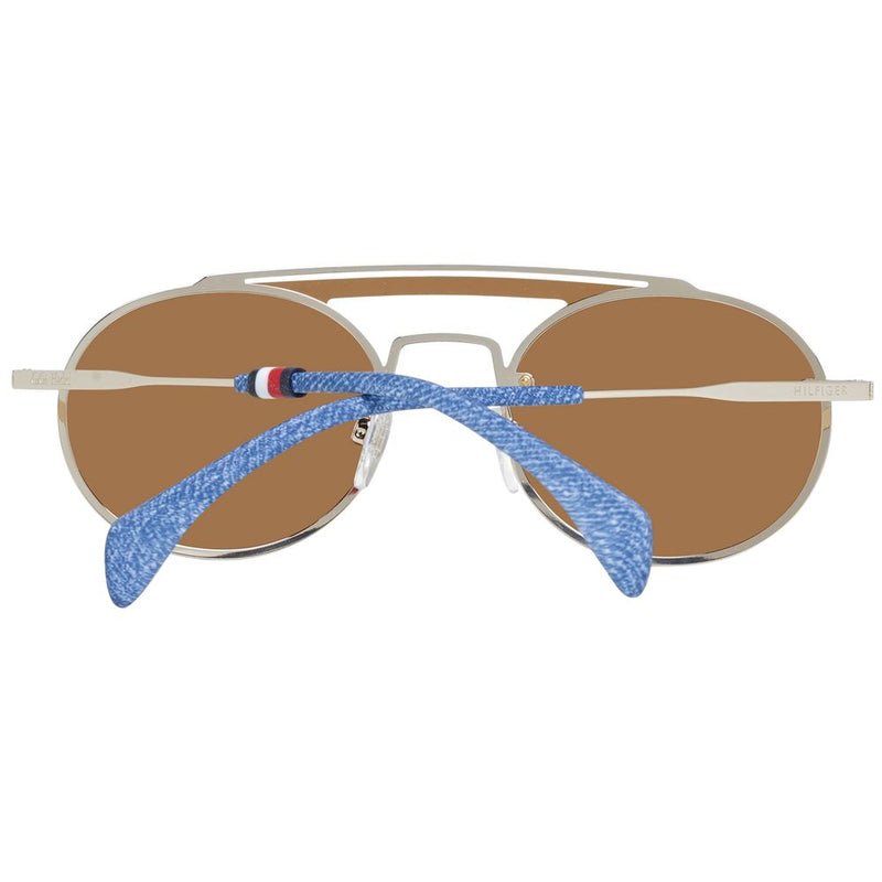 Gold metal aviator sunglasses with brown lenses and folded blue denim temples