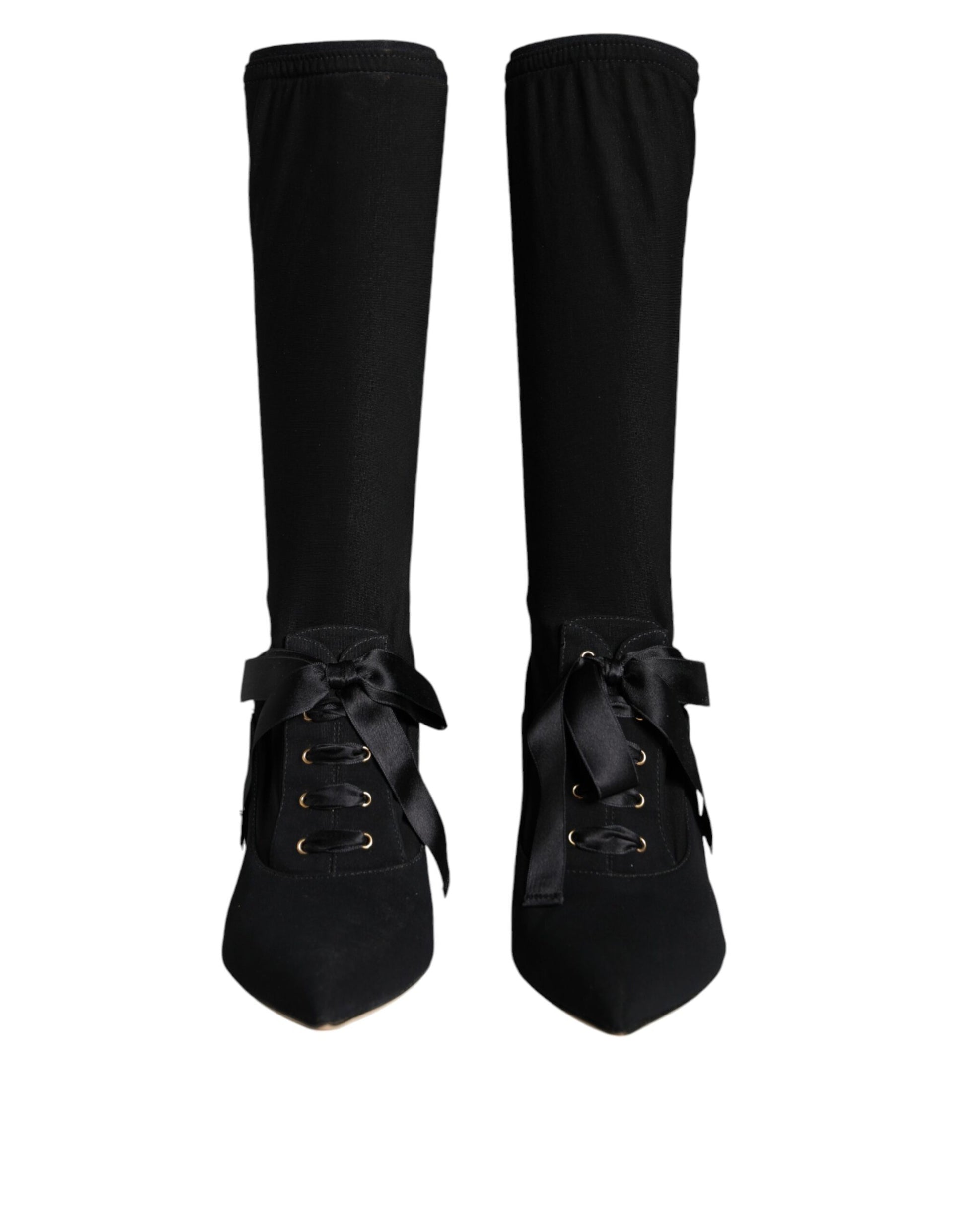 Dolce & Gabbana black mid-calf boots with pointed toes, ribbon lace-up fronts, and stiletto heels.