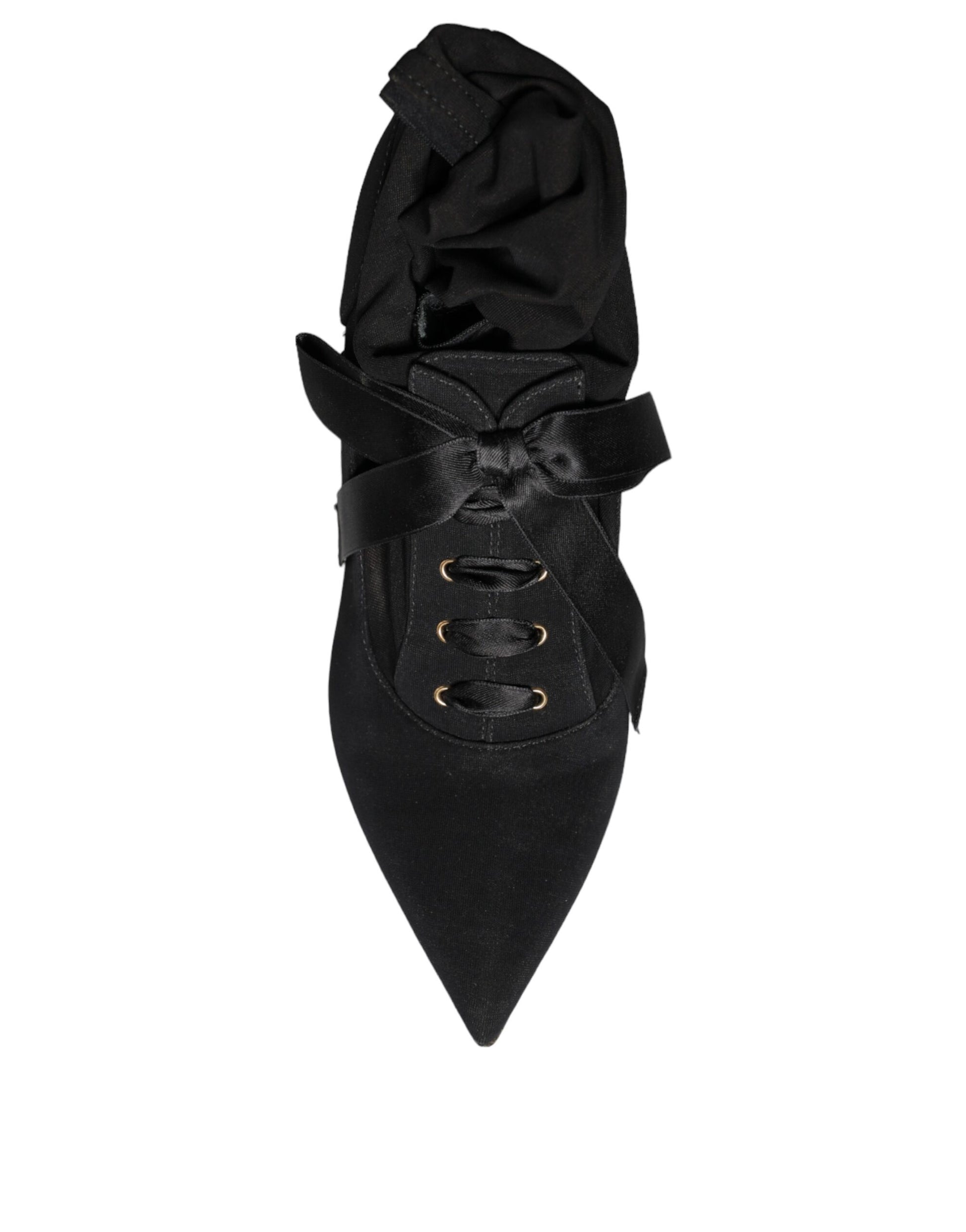 Black suede mid-calf boots with a pointed toe, lace-up front with silk ribbon, and a stiletto heel.