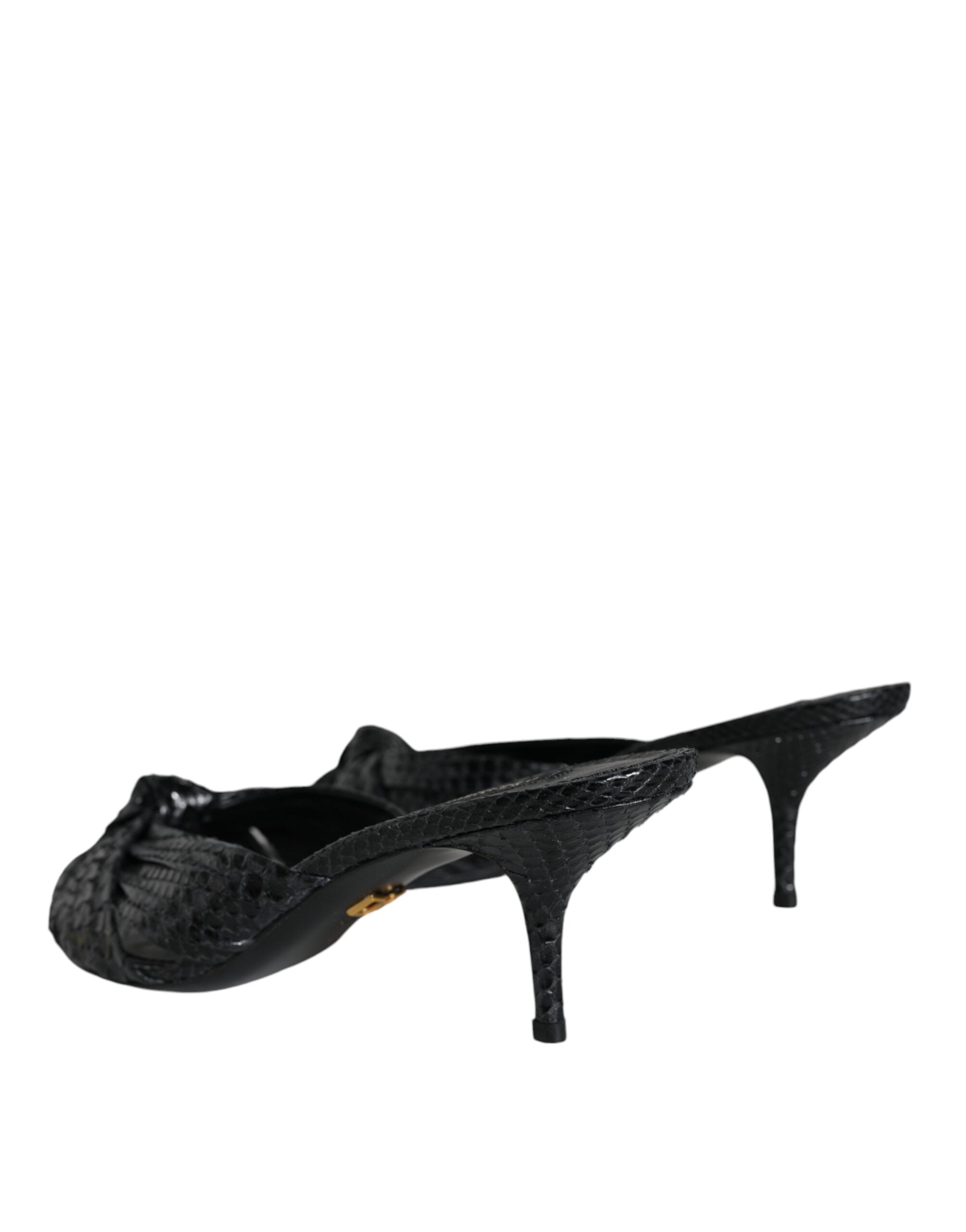 Dolce & Gabbana black snakeskin-textured leather slide heels with a knotted front and slim kitten heel.