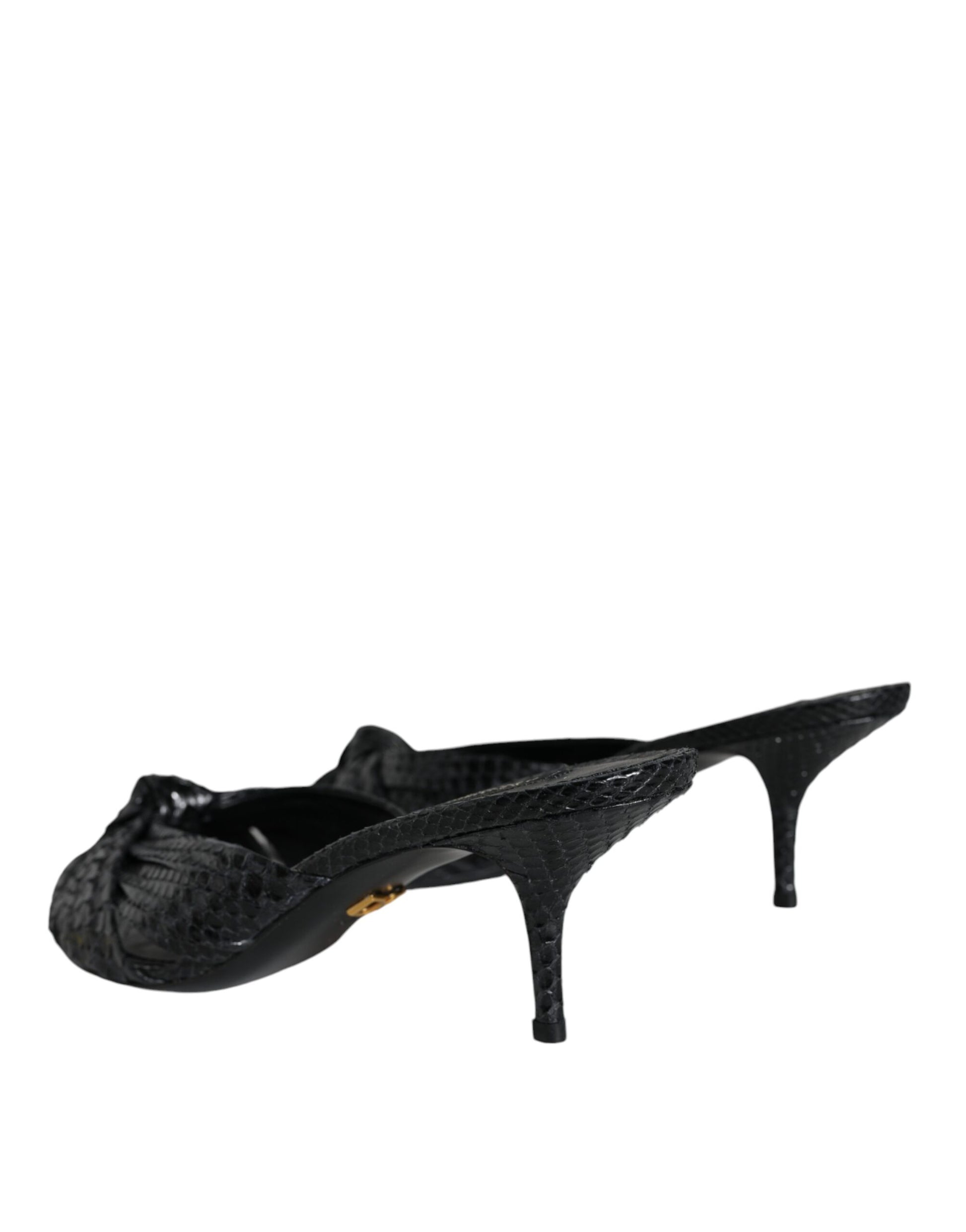 Dolce & Gabbana black snakeskin-textured leather slide heels with a knotted front and slim kitten heel.