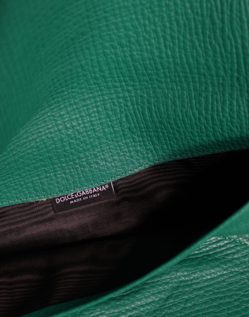 Green textured leather Dolce & Gabbana clutch with black lining and brand label interior