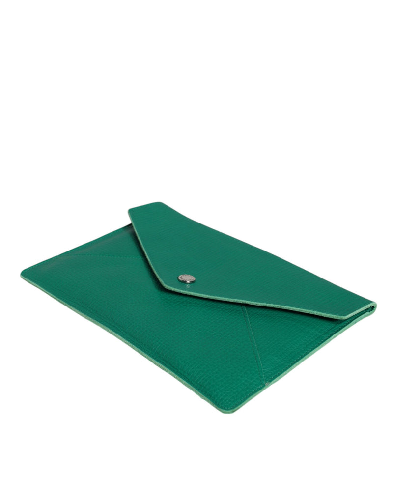 Green leather envelope clutch with a snap button closure