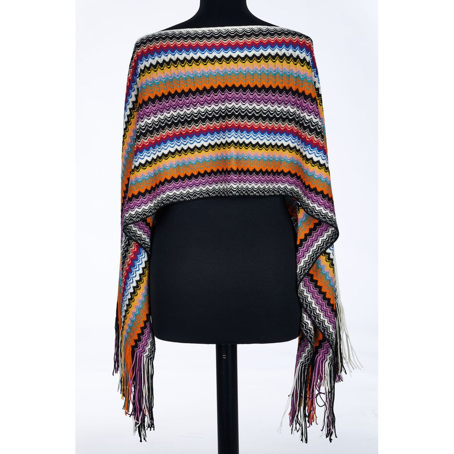 Missoni multicolored zigzag wool poncho with fringe hem on a mannequin