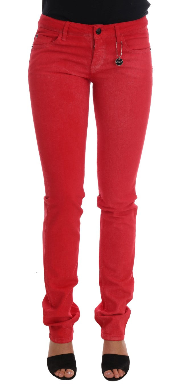 Red stretch cotton slim fit jeans with front pockets and a small charm on the waistband