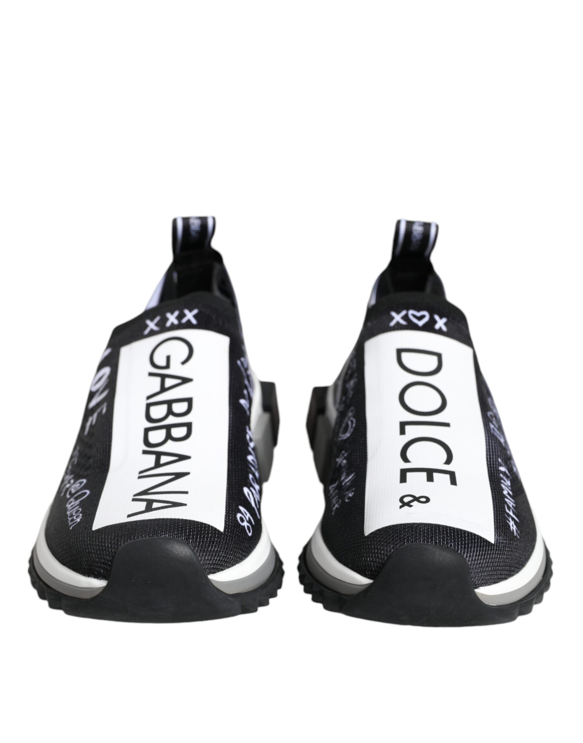Black and white knit slip-on sneakers with D&G logo branding and white graphic text on a rubber sole.