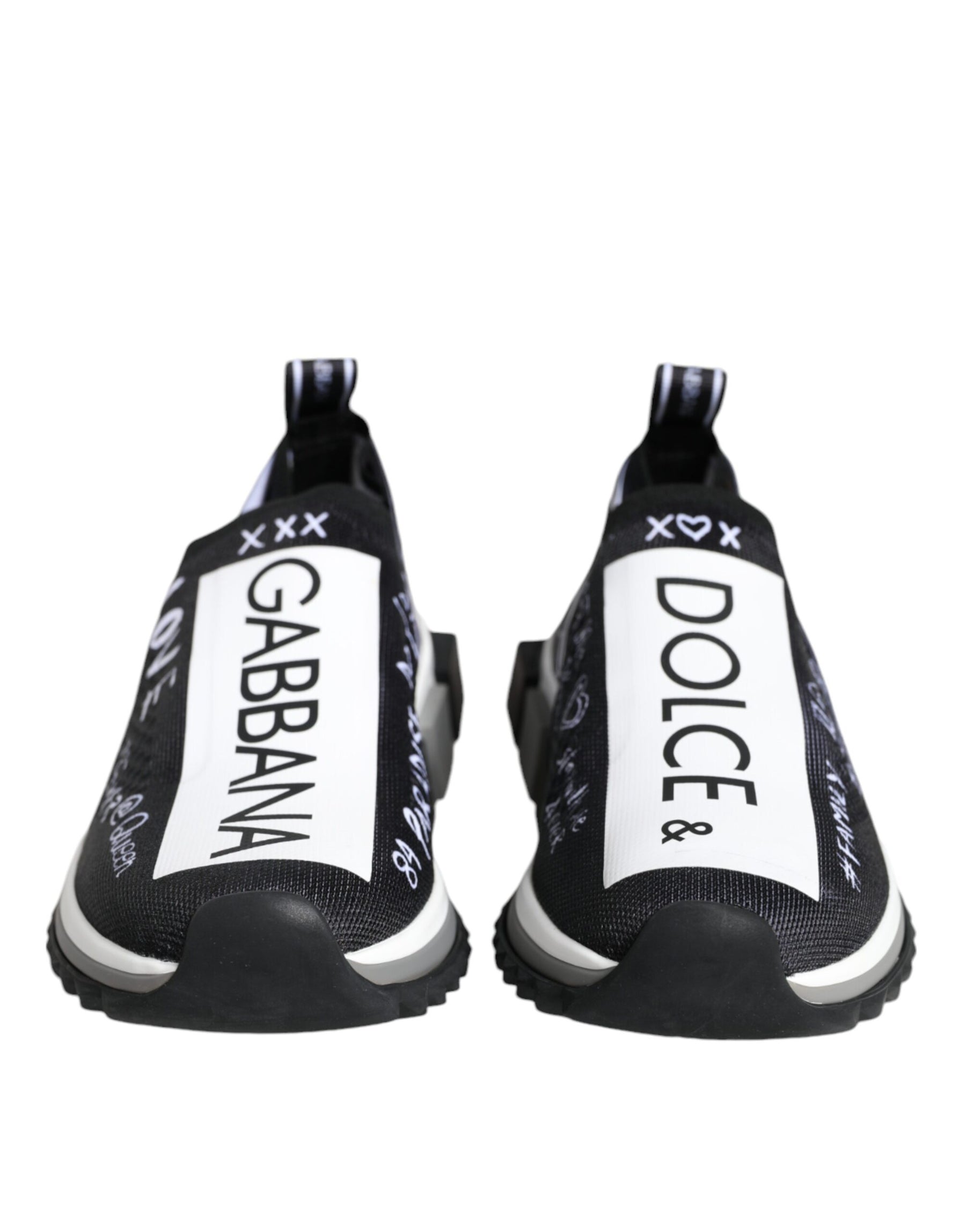 Black and white knit slip-on sneakers with D&G logo branding and white graphic text on a rubber sole.